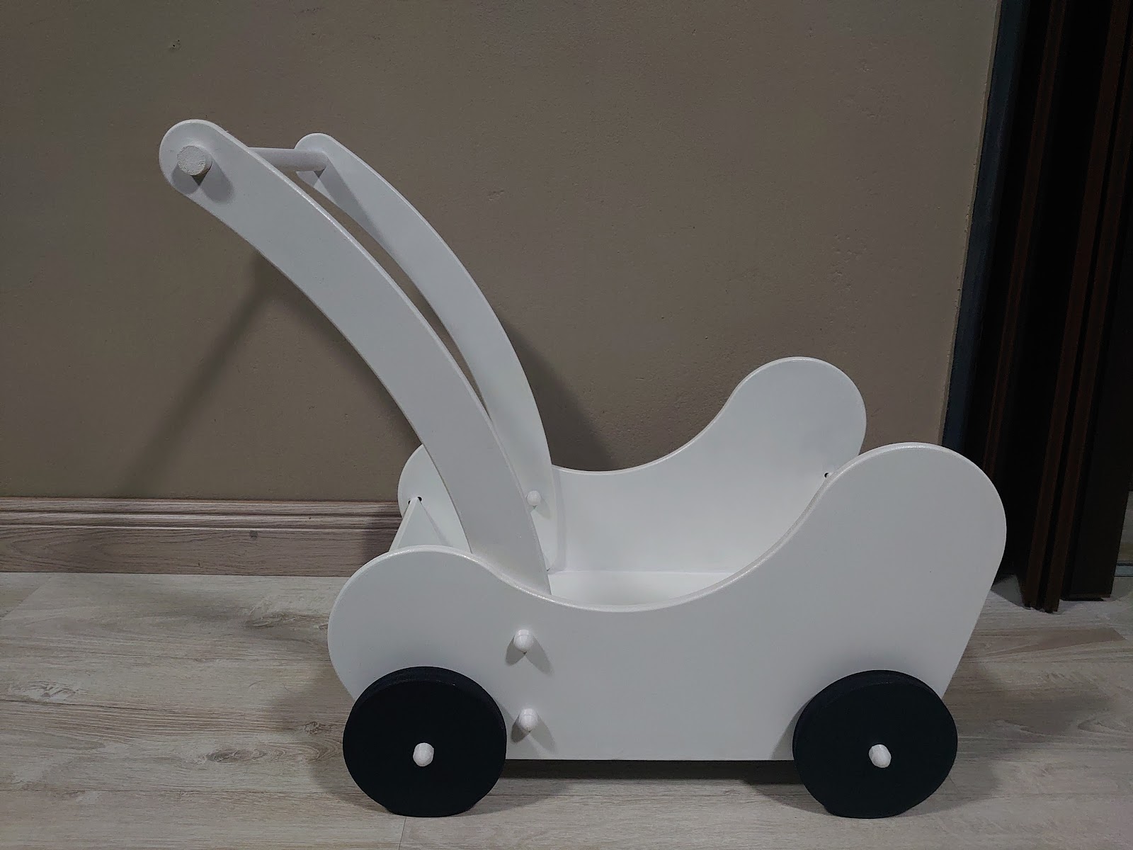 White wooden toy pram